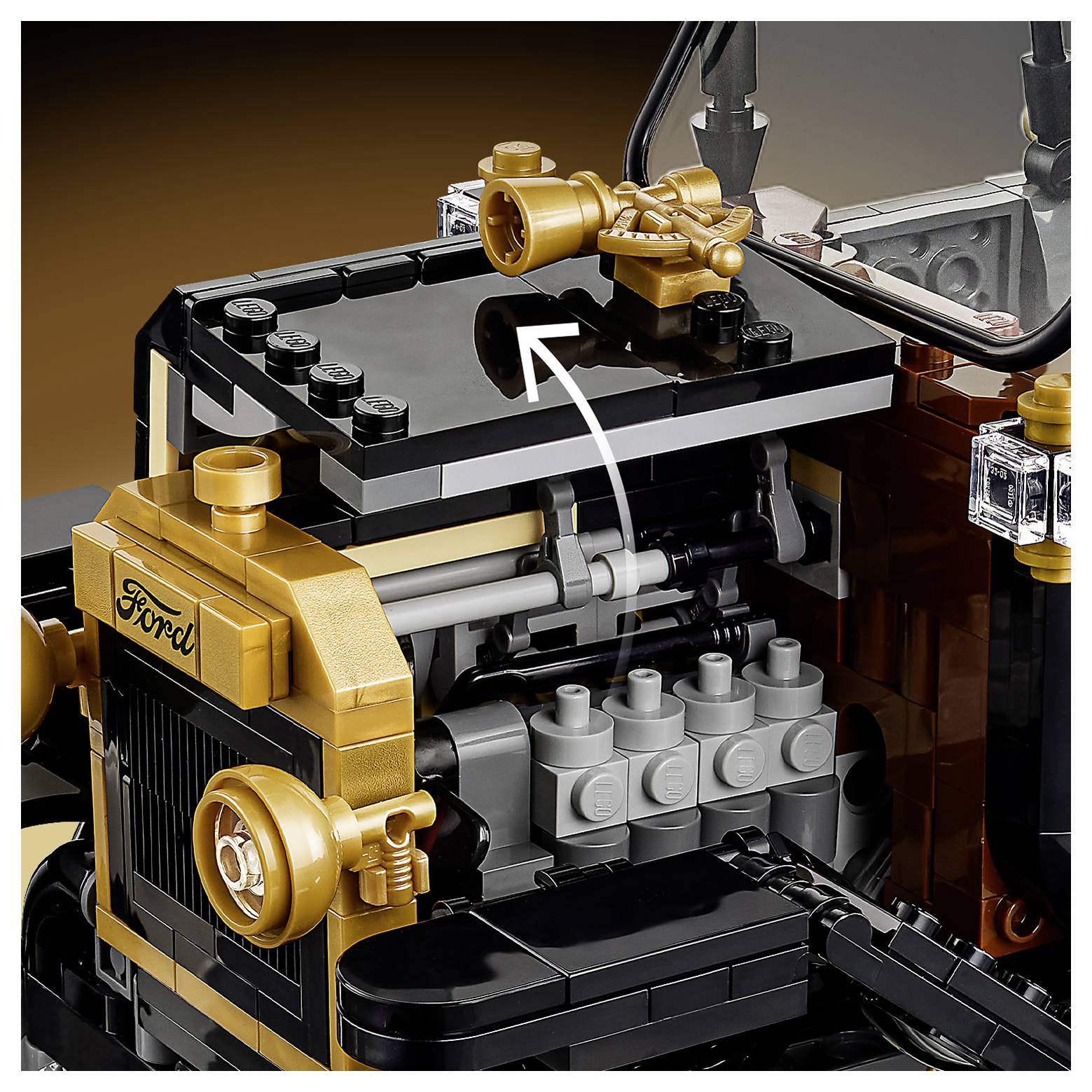 Close-up of a LEGO Ford model engine area, showing detailed construction with intricate components and branded 'Ford' label on the front.