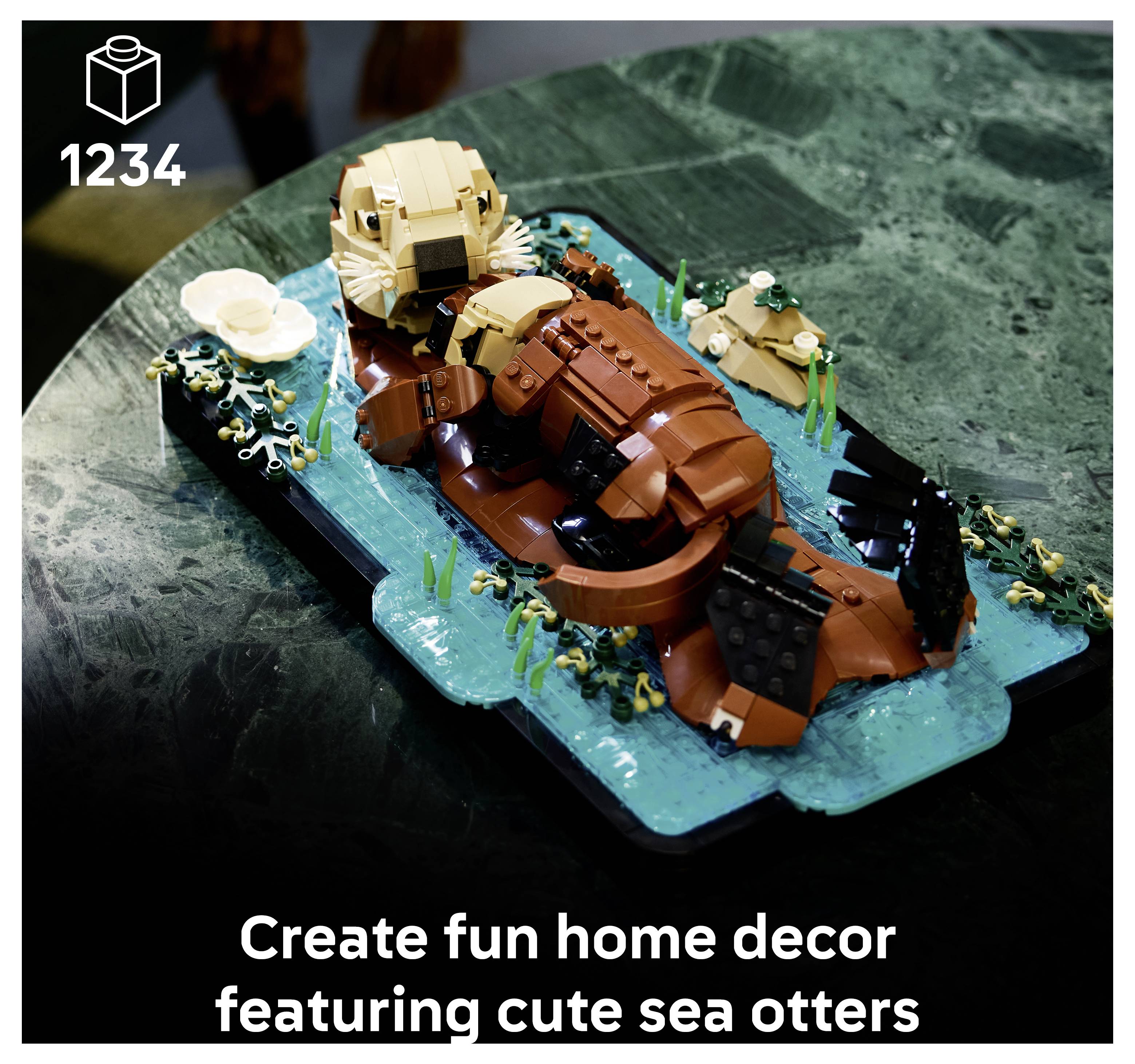 A LEGO model of a sea otter with a baby on its belly, floating on water with green plants, used for home decor.