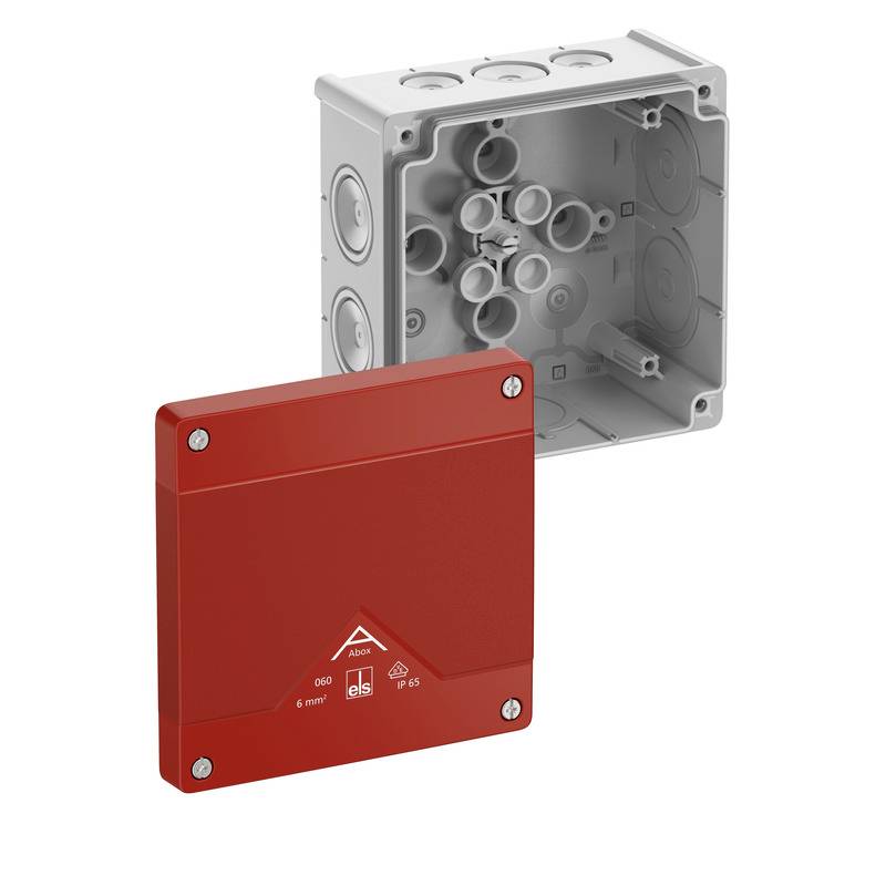 Red electrical junction box cover in front of an open gray electrical enclosure with cable entry holes.<br>