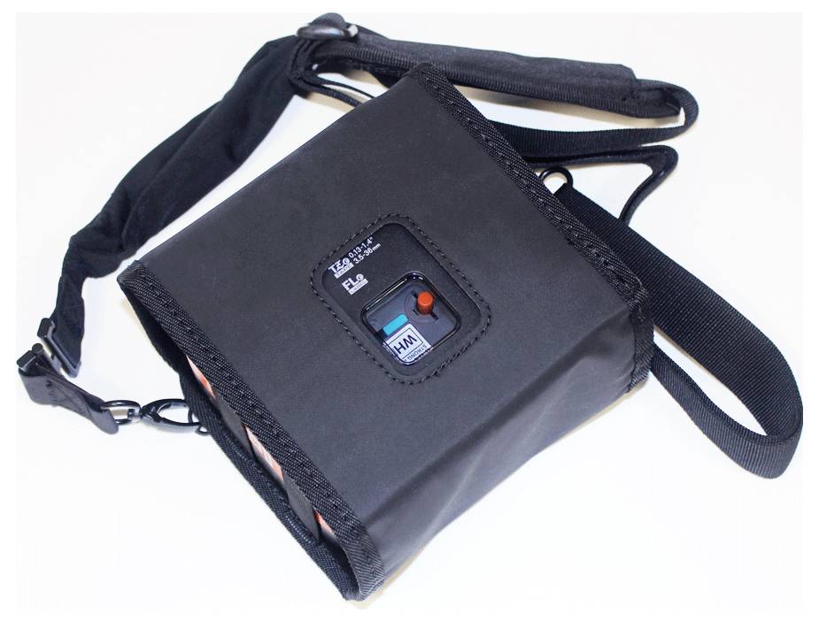 A black device with straps and a display panel showing a toggle switch labeled 'Kiln' and 'Main'.