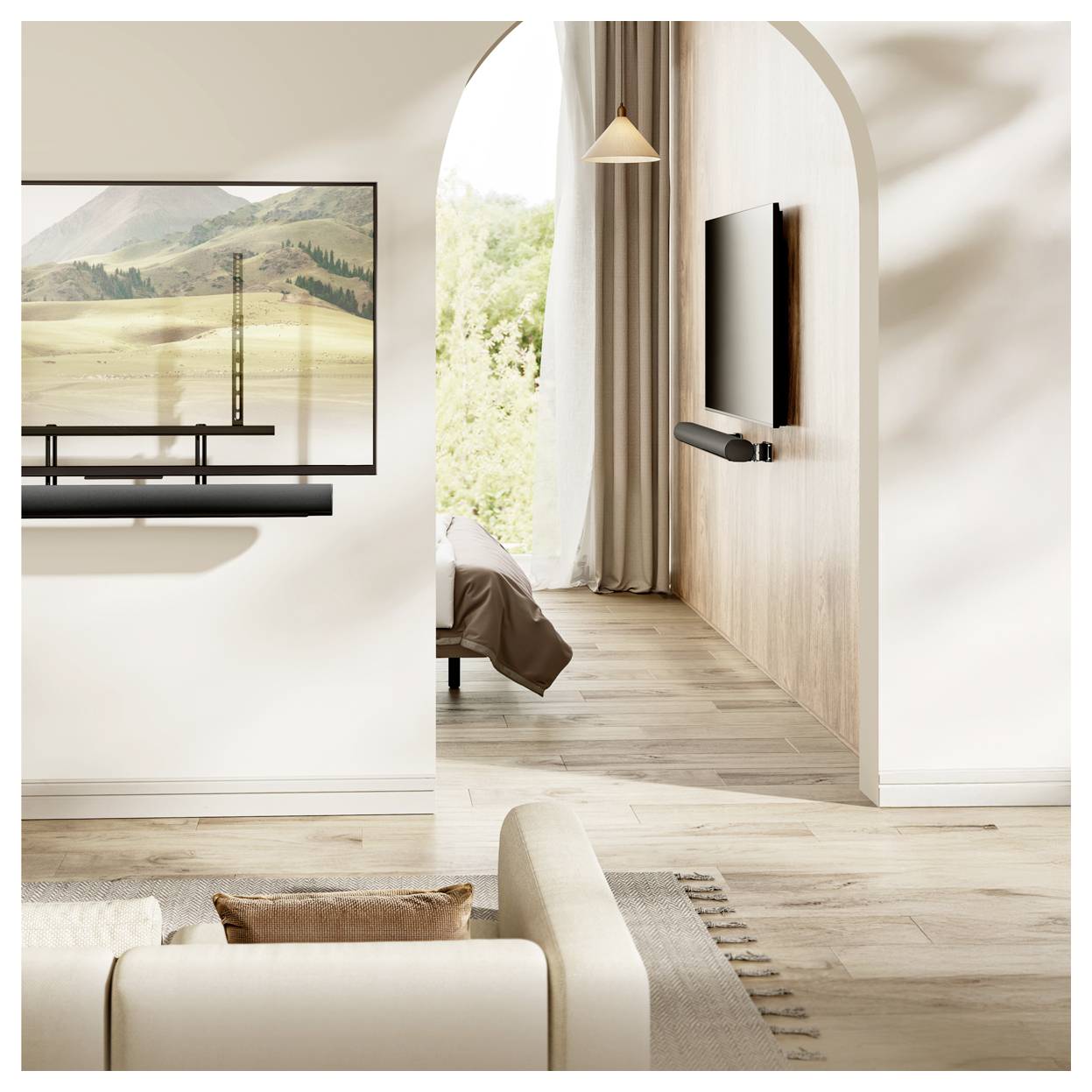 A modern living room features a beige sofa, a wall-mounted TV near a cozy bed, and a large landscape painting, with natural light flowing in.