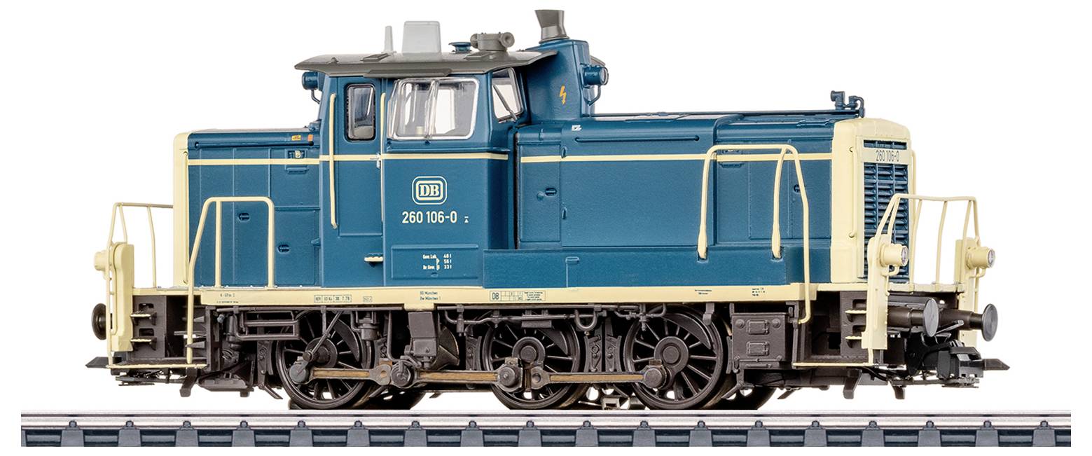 A model train locomotive in blue with beige trim, marked 'DB 260 195-0', shown on a track against a plain white background.
