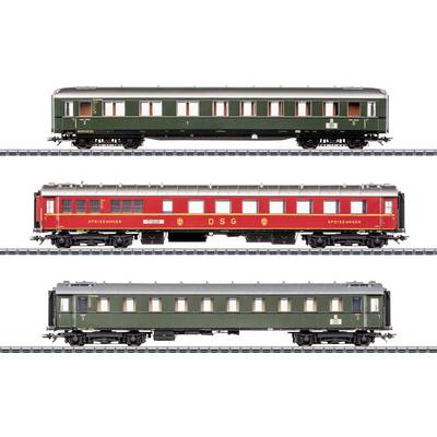 Three model train carriages: two green, one red with 'DSG' text. Each has detailed windows and sits on realistic tracks.