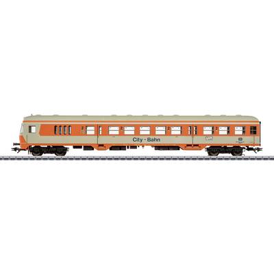 Model train car with 'City-Bahn' text, orange and beige paint, and logo. Features six windows and detailed undercarriage, on track.