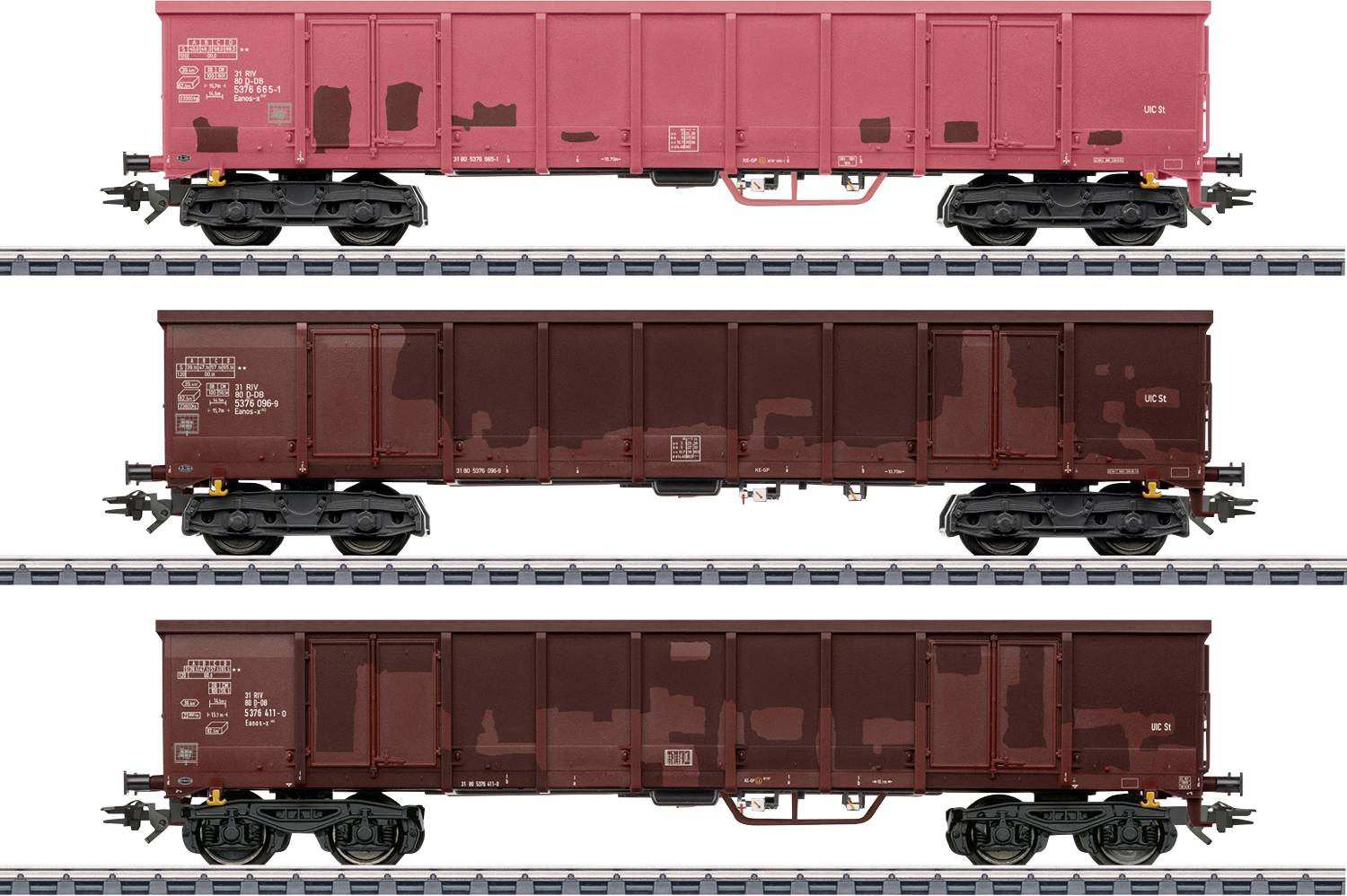 Three side views of model freight train cars on tracks; top car is red, middle and bottom cars are dark brown, all with white text.