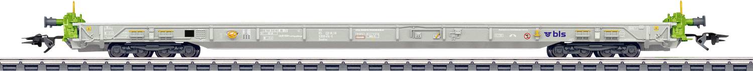 A futuristic transportation vehicle on tracks, featuring a sleek design with green accents and antennas on each end.
