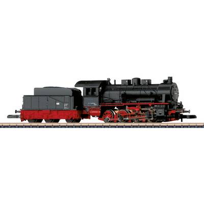 A black and red model steam locomotive displayed on a track, showcasing detailed wheels and engine components.