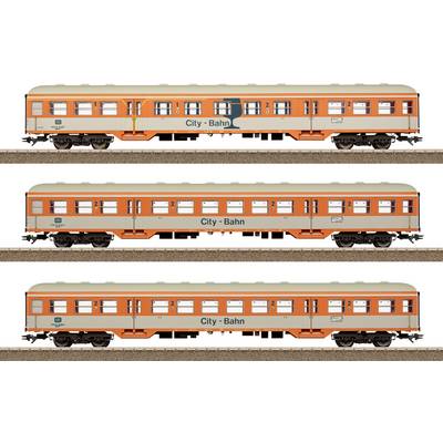 'City-Bahn' train, orange and beige, shown in three views on tracks. Model train design with windows and doors depicted.