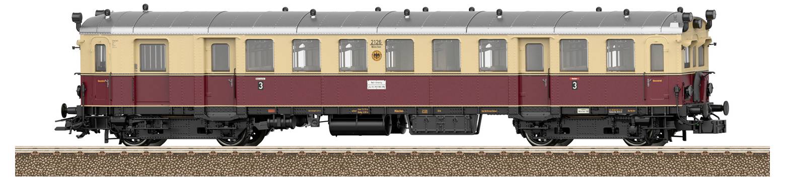 A vintage train carriage with a beige and maroon color scheme stands on a track, showcasing its detailed exterior design.