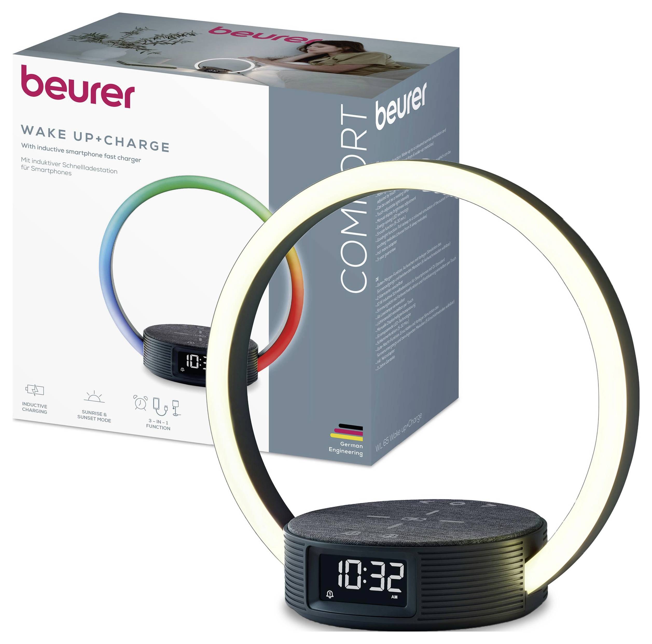 A circular lamp with a digital clock display shows '10:32'. The box behind it reads 'Beurer Wake Up + Charge' with a colorful ring image.