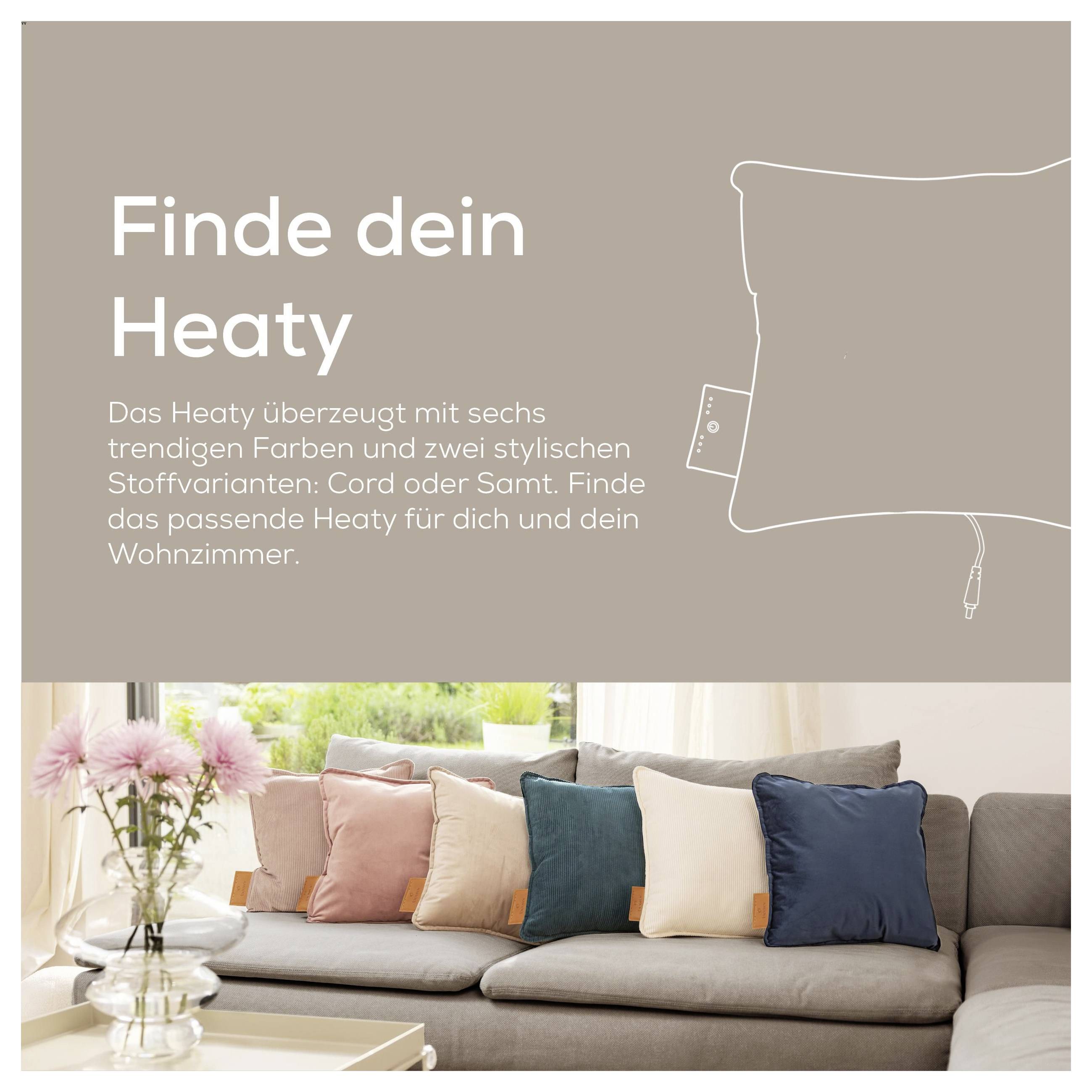 'Couch with multicolored cushions in a living room. Text reads: Finde dein Heaty. Six trendy colors in cord or velvet fabrics.'