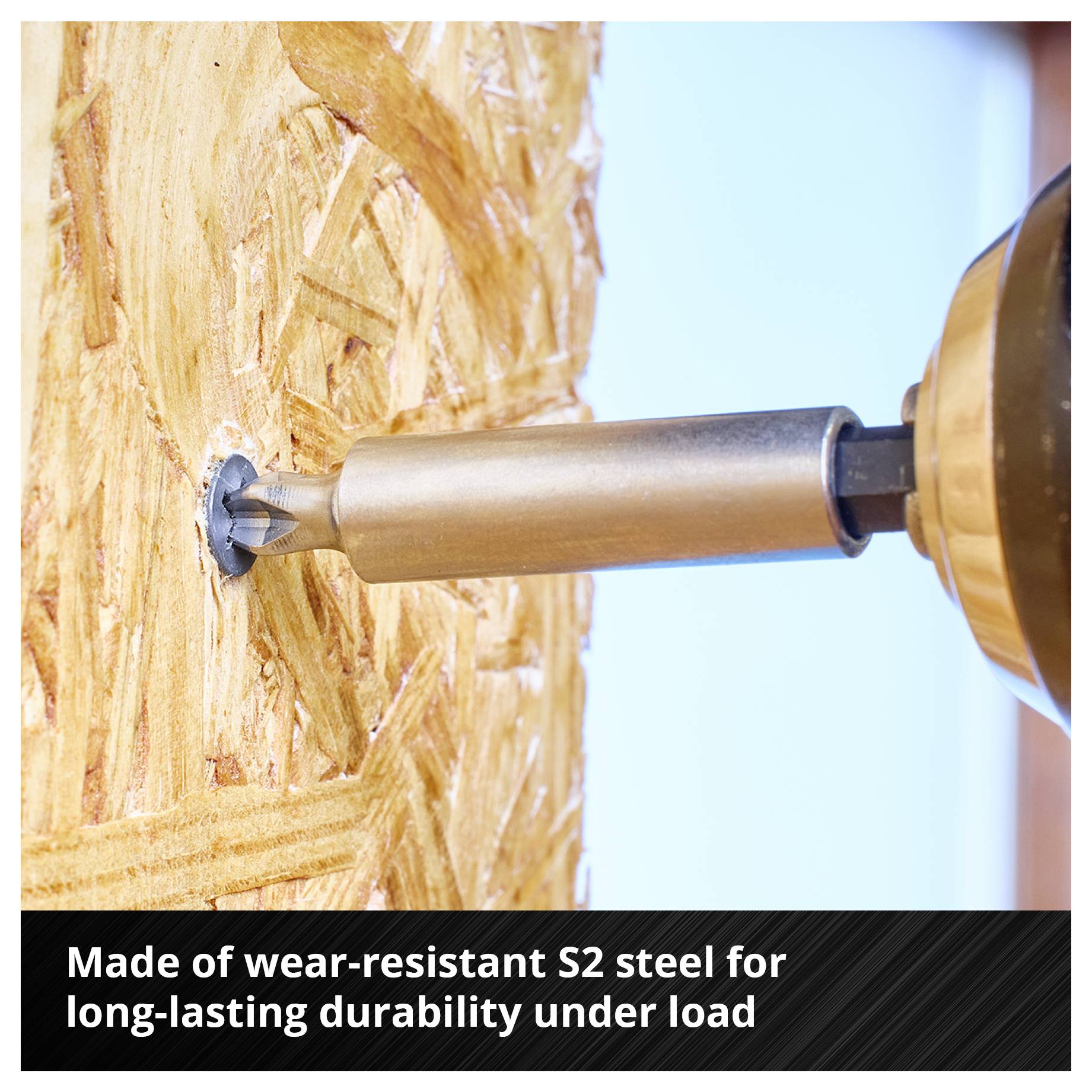 Drill bit boring into wooden board. Text: 'Made from wear-resistant S2 steel for long service life under heavy load'.