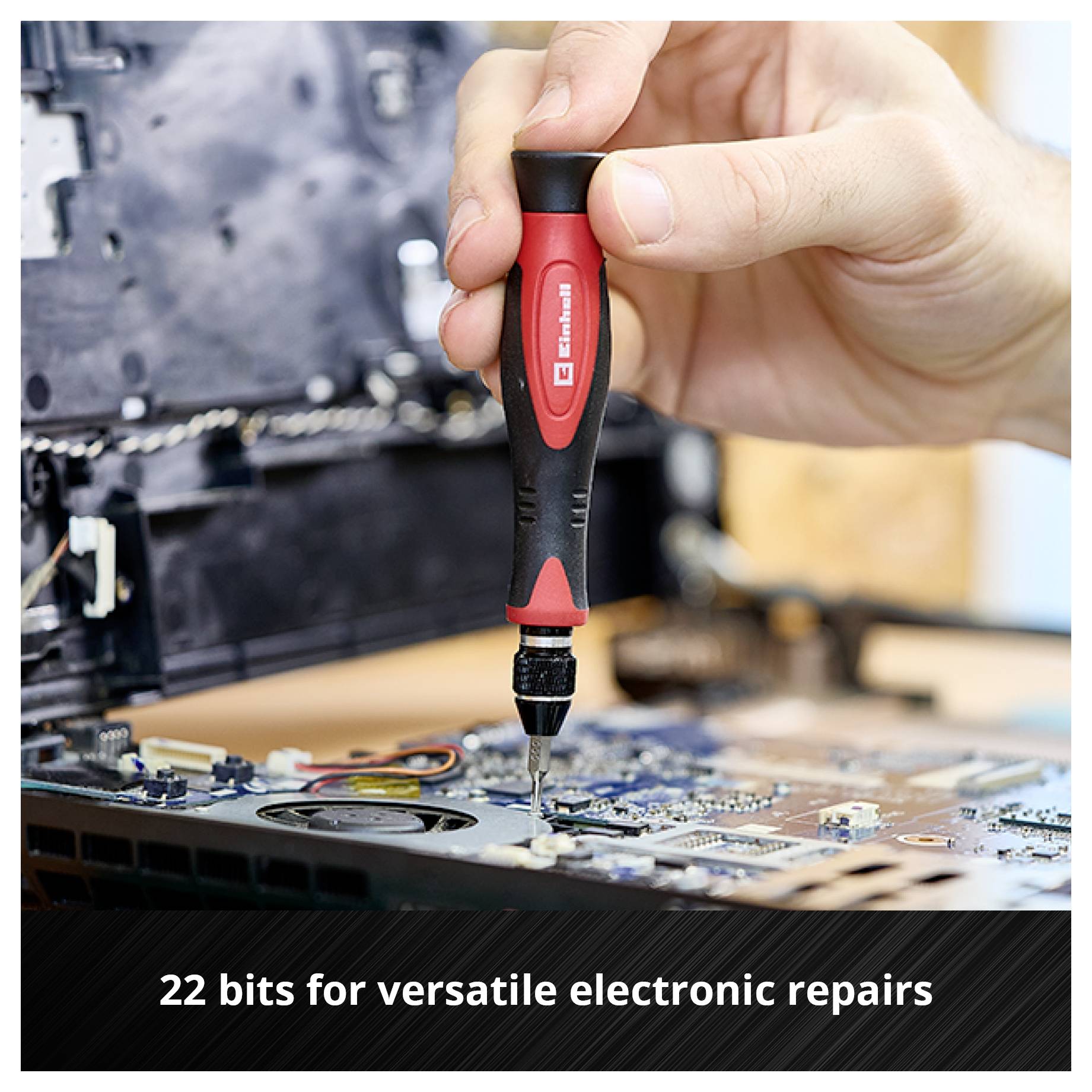 'Hand holds screwdriver, repairs electronic device. Text: 22 bits for versatile electronics repairs.'