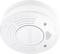 A white smoke detector with 'Test/Hush' button, air vents, and guidance to 'Twist to Remove' visible.