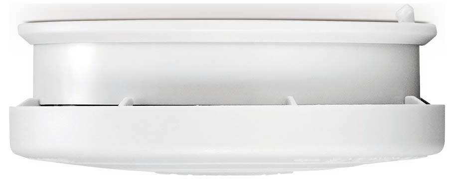 A white smoke detector viewed from the side, showing its circular form and vents.