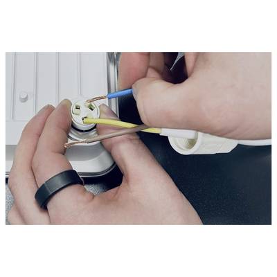 Hands wiring a plug or electrical connector with stripped blue, brown, and yellow cables.