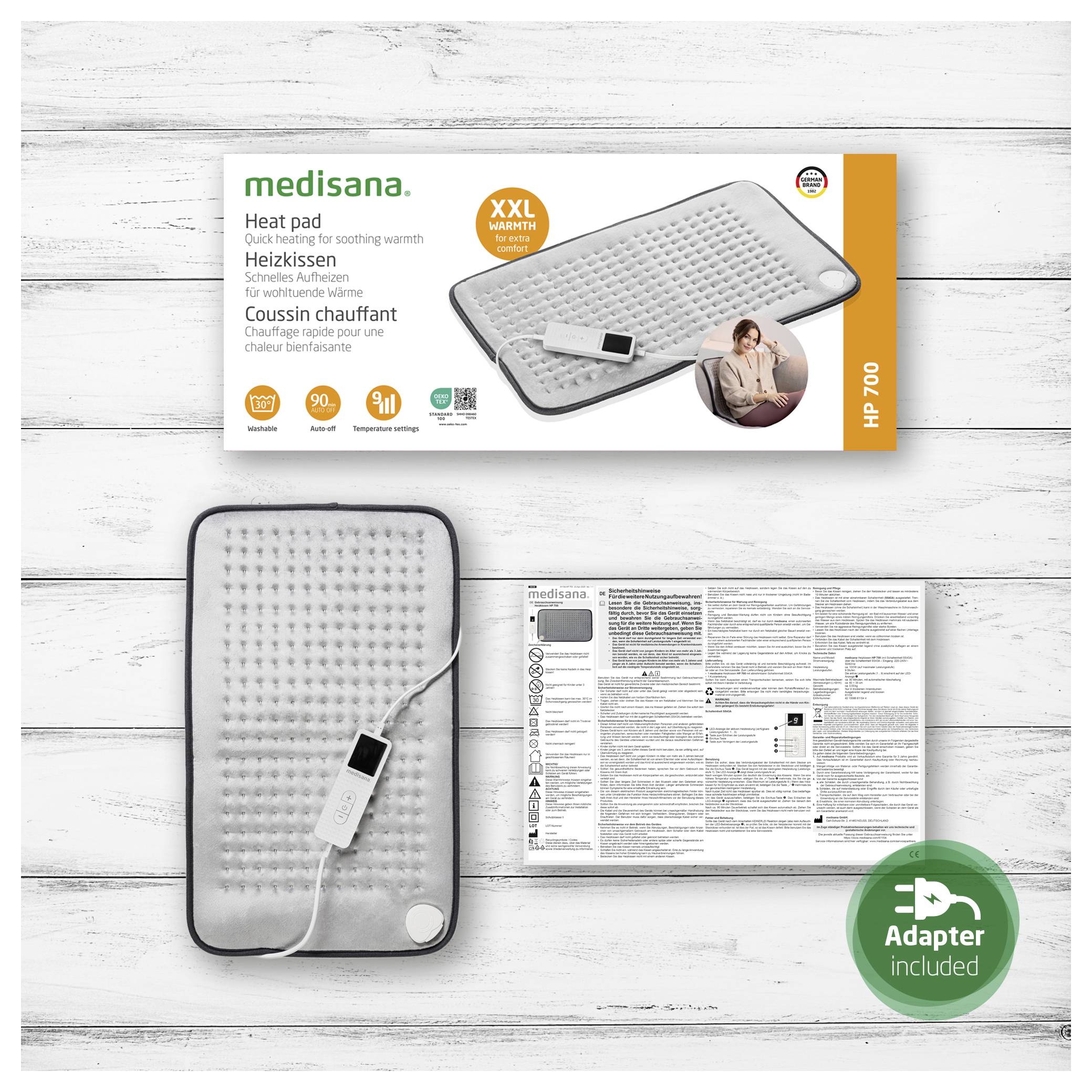 Medisana XXL heat pad packaging with an image of the pad featuring a digital remote. A round label indicates 'Adapter included.'