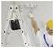 Person wearing a hard hat uses a paint roller on a wall while standing near a ladder holding tools in a pouch.