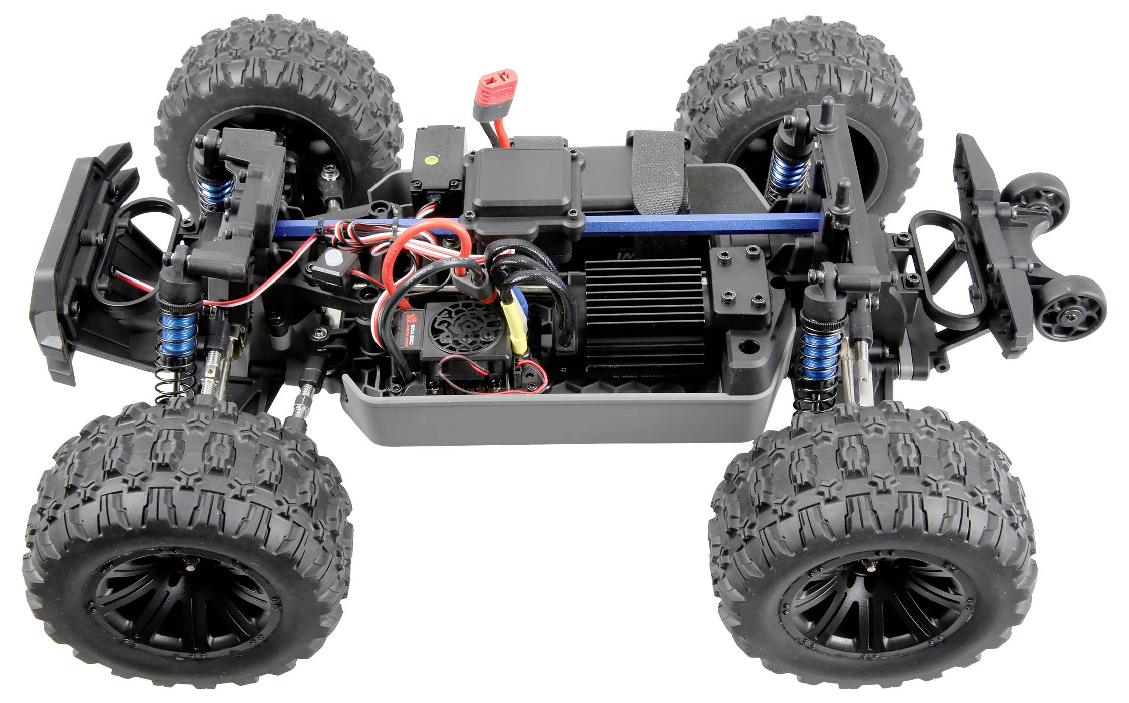 A remote-controlled car with large off-road tires and visible interior wiring, showcasing its electronic components and suspension system.
