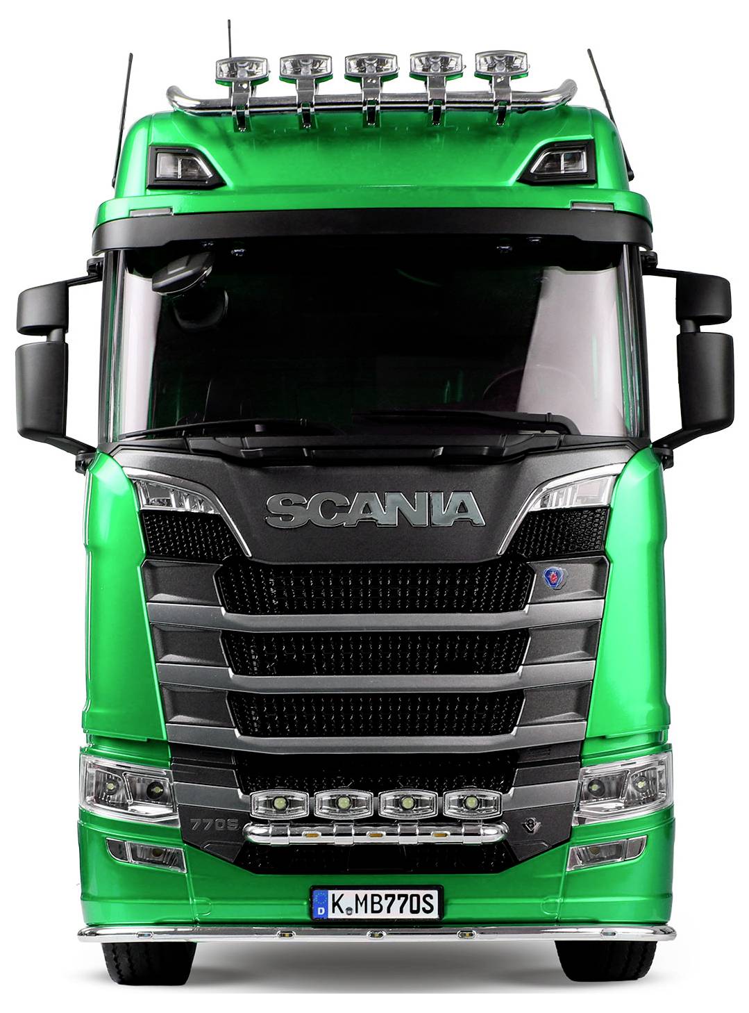 A green truck with a prominent front grille and the word 'Scania' on the hood. The truck is viewed from the front.