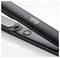 A black hair straightener with digital temperature display and power button visible, set against a white background.