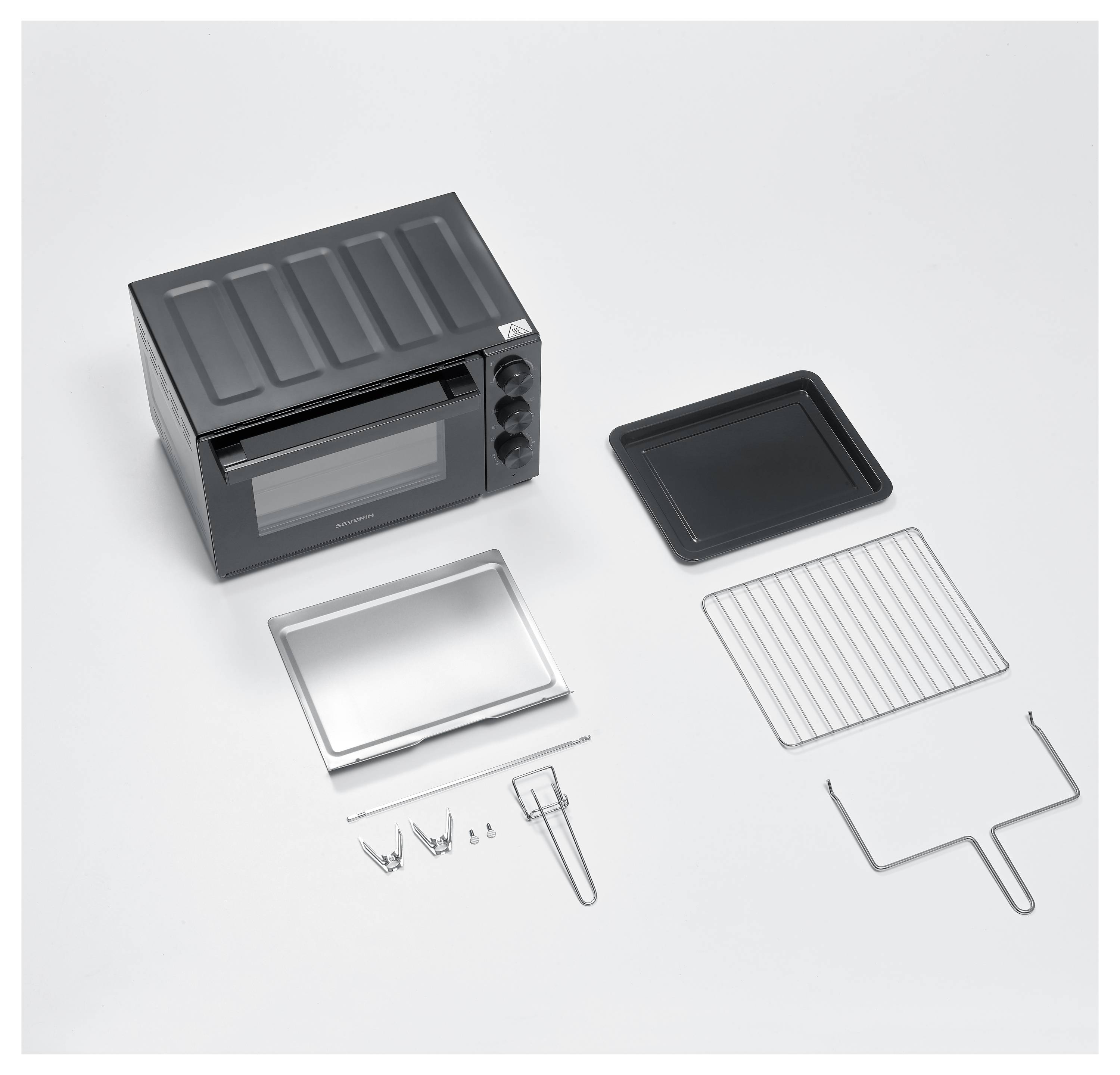 A black toaster oven with an open door is shown with accompanying accessories: a baking tray, rack, handle tool, and skewers.