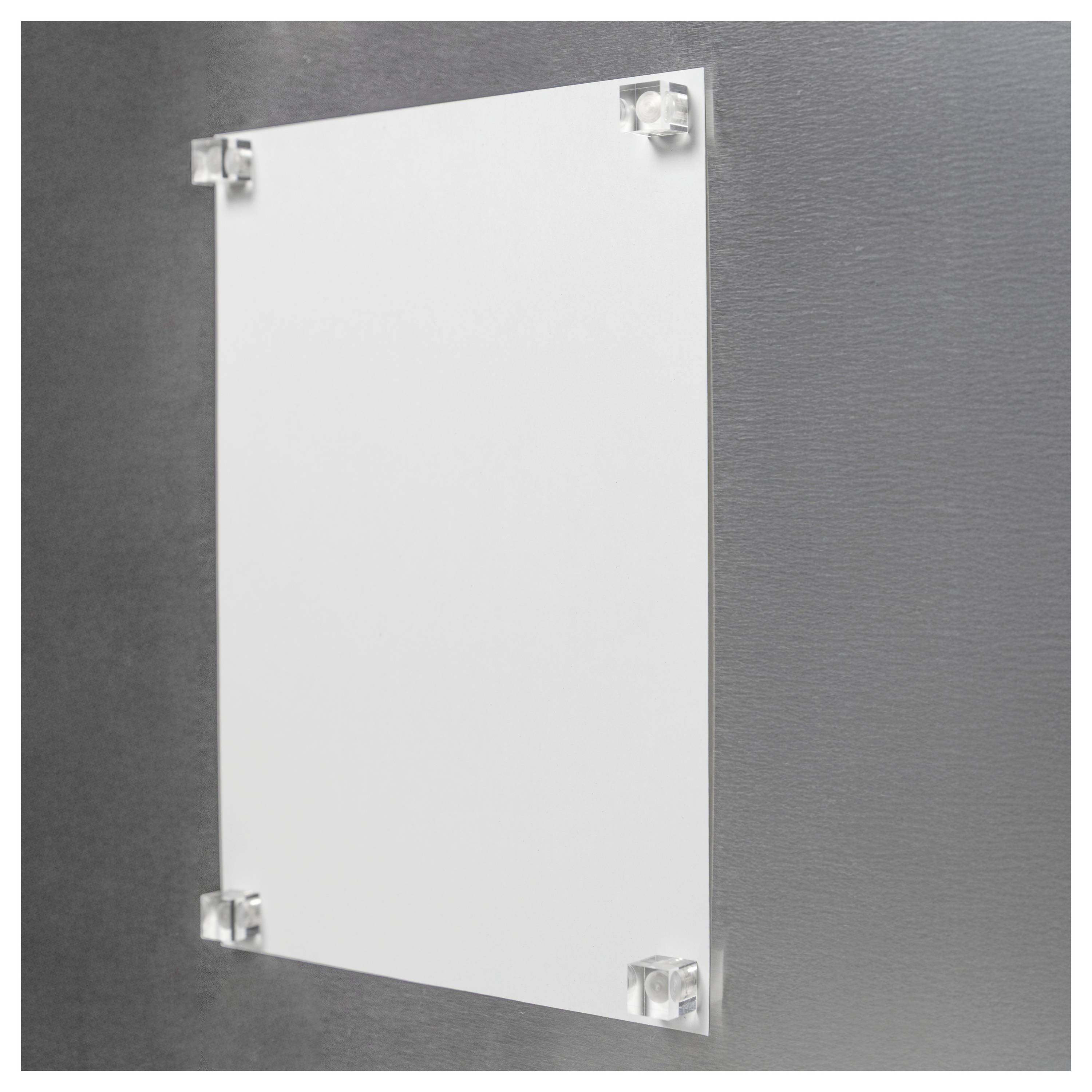 A clear acrylic wall sign holder with a single white blank sheet inserted, mounted on a gray wall using four screws.