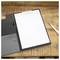 A blank clipboard with a white sheet of paper and a pen on a wooden surface, ready for note-taking or documentation.