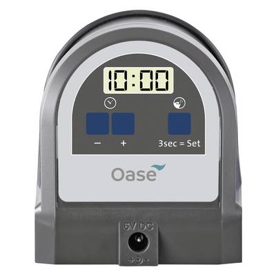 Digital timer device showing 10:00, with blue buttons for minus, plus, and '3sec = Set', branded Oase.