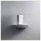 'A single devolo unit placed on a simple wall shelf against a plain, grey concrete backdrop, showcasing minimalistic home decor.'