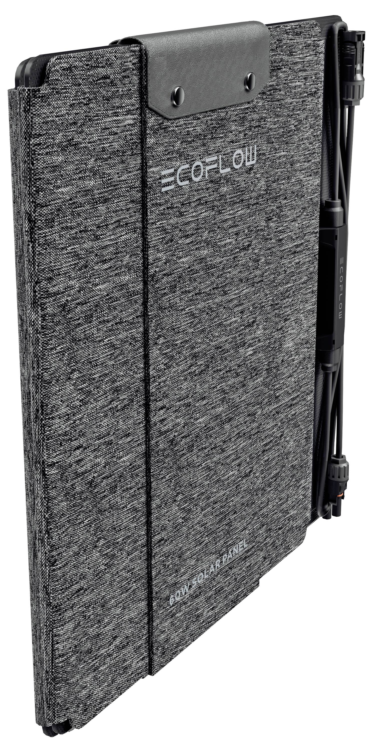 Portable solar panel folded, featuring a sleek gray fabric exterior and connectors neatly secured on the side.