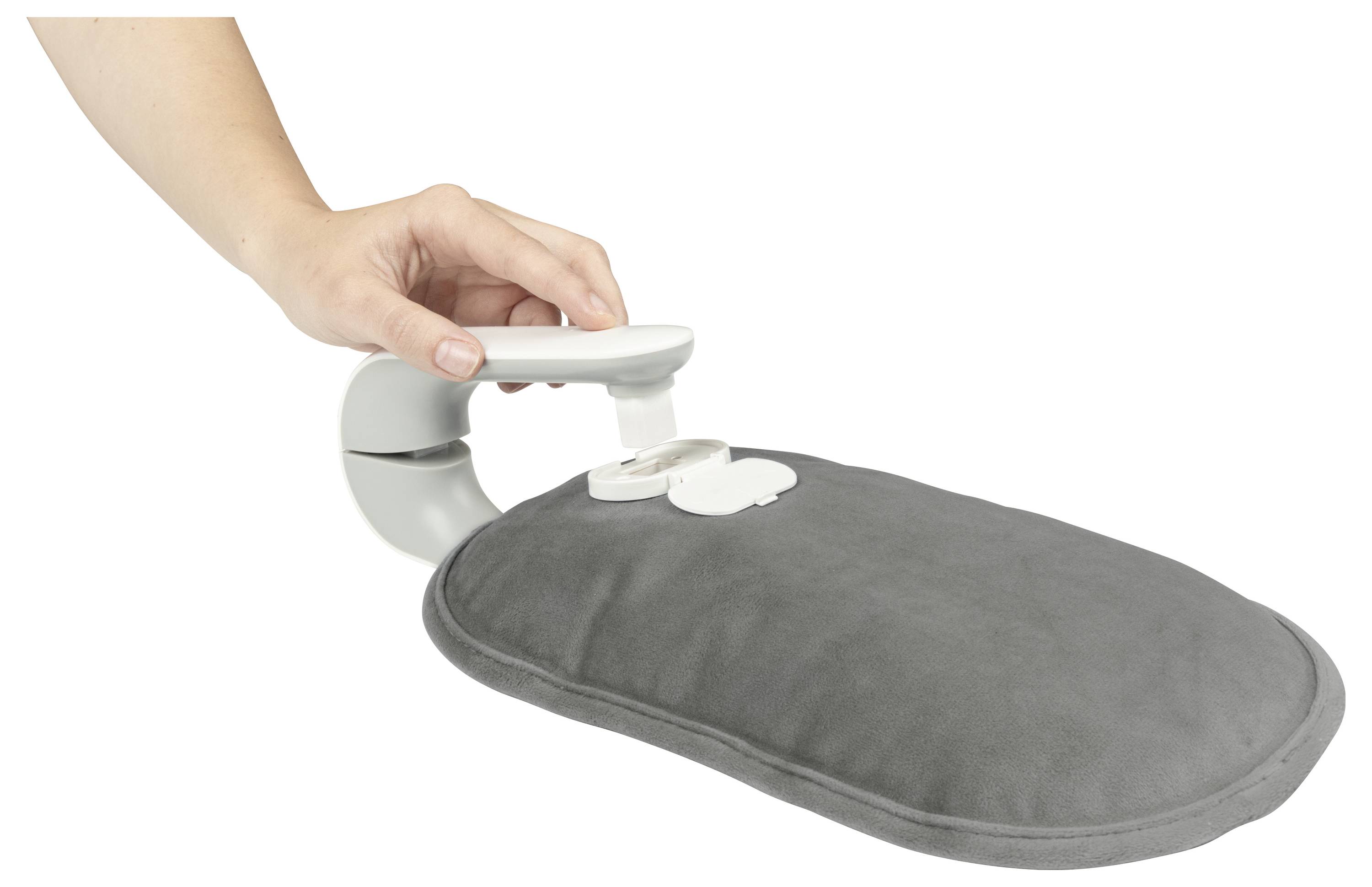 A hand fills a gray hot water bottle with a nozzle, showing a fill-up process for heating purposes.