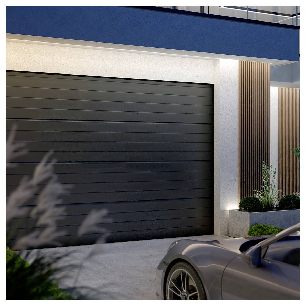 A modern garage with a closed black door beneath a building, partially visible car, and plants along the side. Minimalist design.