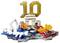 LEGO Monaco Formula 1 race scene with a McLaren car, driver, podium, and large gold '10' backdrop on a stylized circuit display.