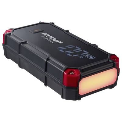 Black and red VOLTCRAFT portable power bank with LED display and glowing front light, shown on a white background.