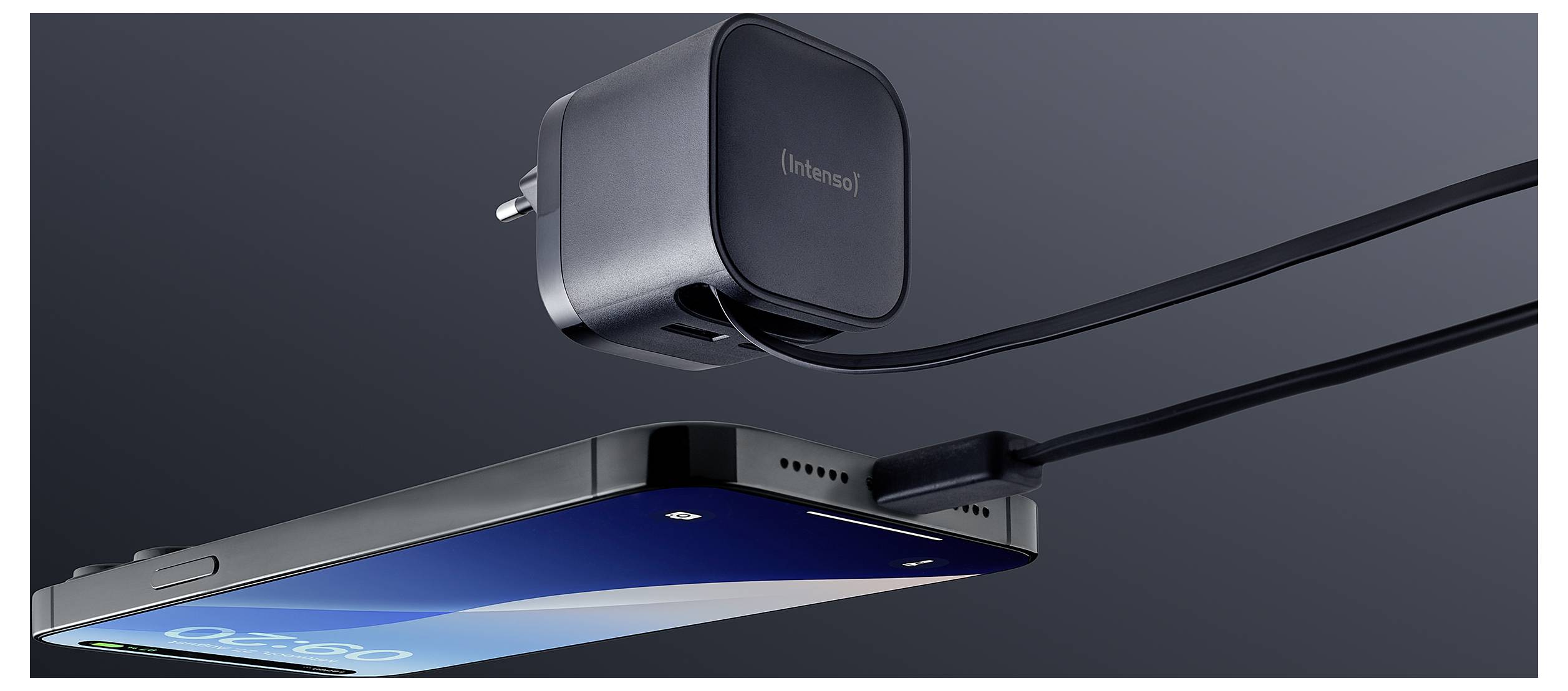 A smartphone suspended in mid-air is connected to a grey charging adapter labeled 'Elemental' by a cable, against a dark background.