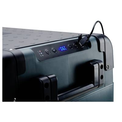 Close-up of a portable cooler control panel with a blue digital display reading 'SET 66C', buttons, and a power cable plugged in.