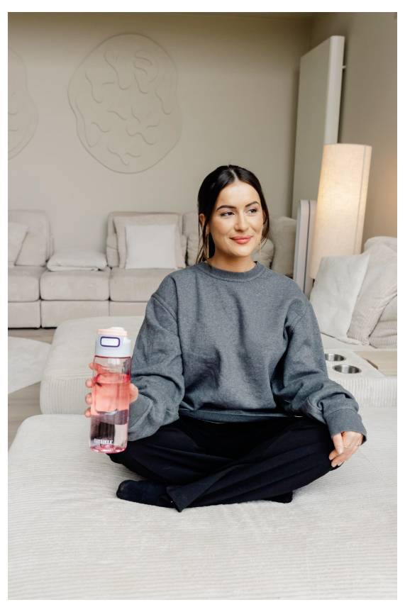 'Motorola Edge 50 Fusion', woman leaning against her hand, close-up of mobile phone with dual camera displayed.