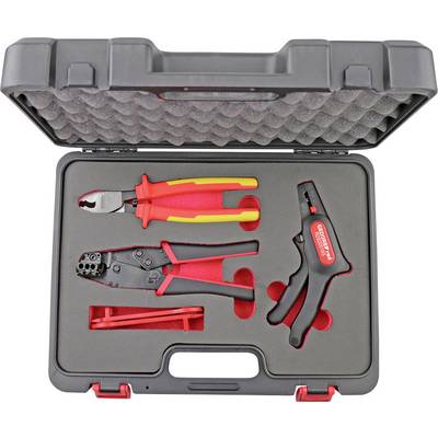 A plastic tool case containing three red and black hand tools — a cutter, a crimping tool, and a wire stripper — in fitted slots.