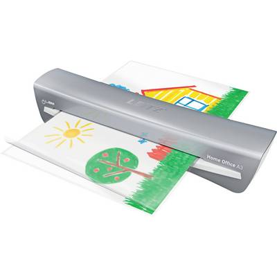 A home laminator machine in use, laminating a colorful child's drawing of a house and tree with a sun in the sky.