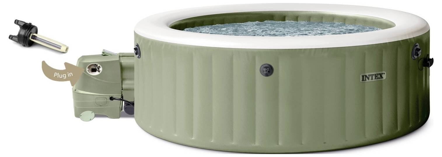 Inflatable green hot tub filled with water, with a connected external heater and a 'Plug In' label near the heater's plug area.