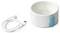 A white ceramic pet bowl with a blue base, next to a USB charging cable.