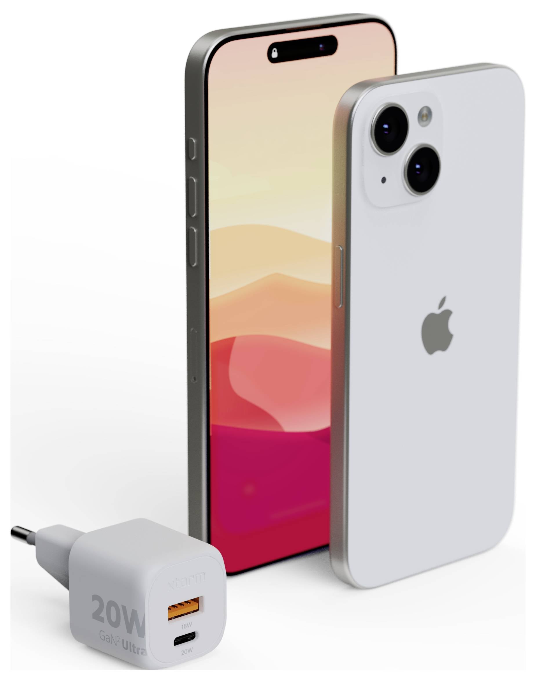 Silver smartphone standing next to a charging adapter, showcasing the front display with vibrant gradient wallpaper and dual rear cameras.