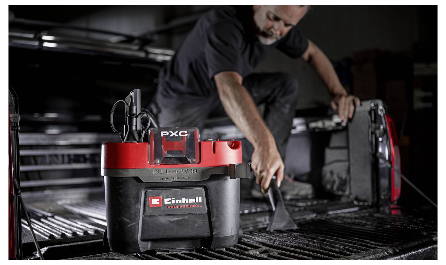 Finger pressing button on a vacuum cleaner with text: 'ECO/BOOST mode for maximum battery life or maximum suction power'.