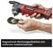 Person holding a red and black magnetic grinder. Text: 'Magnetic tool holder for easy accessory changing'.