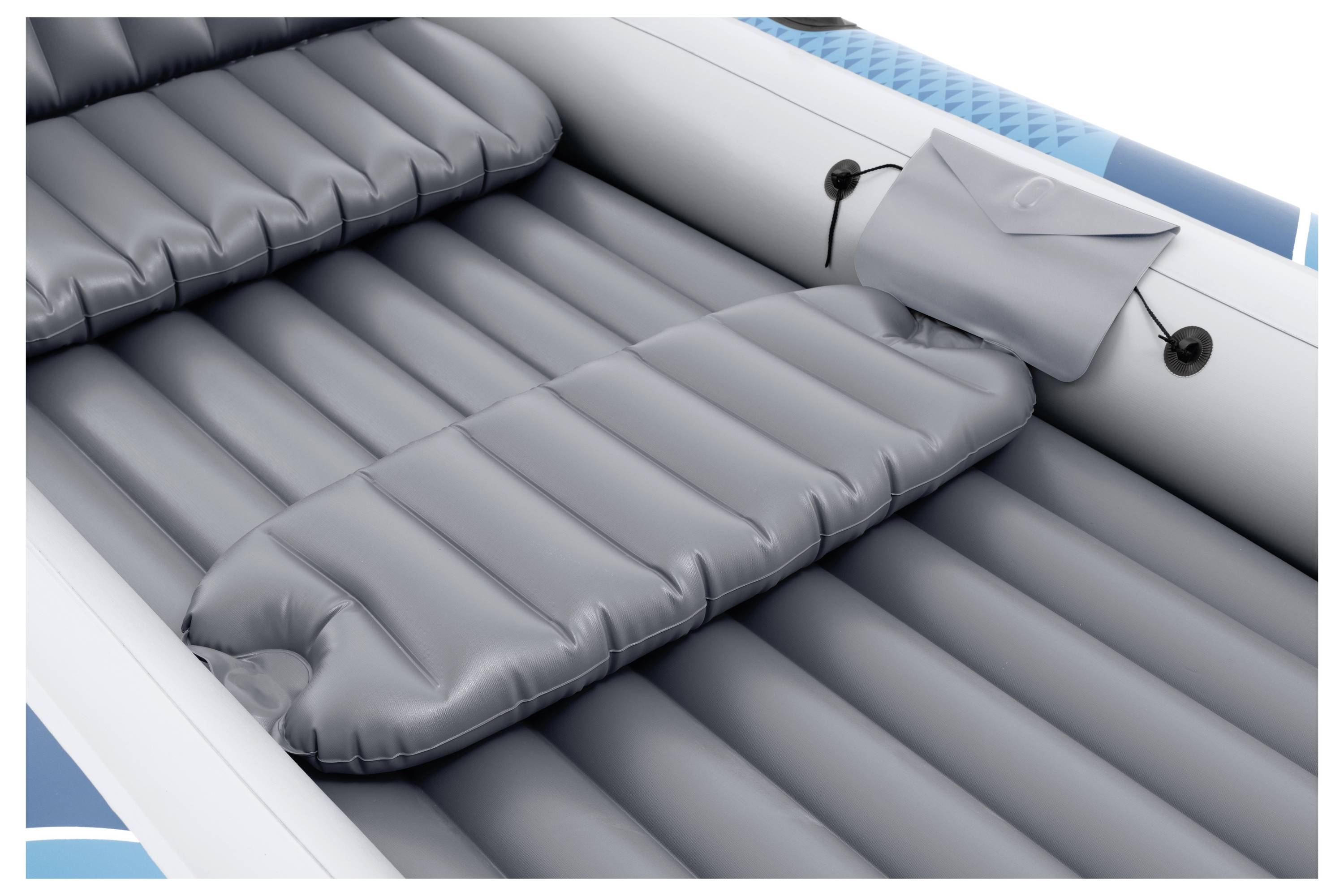 Inflatable blue and grey boat interior with two cushioned seats and a small attached storage pouch on the side.
