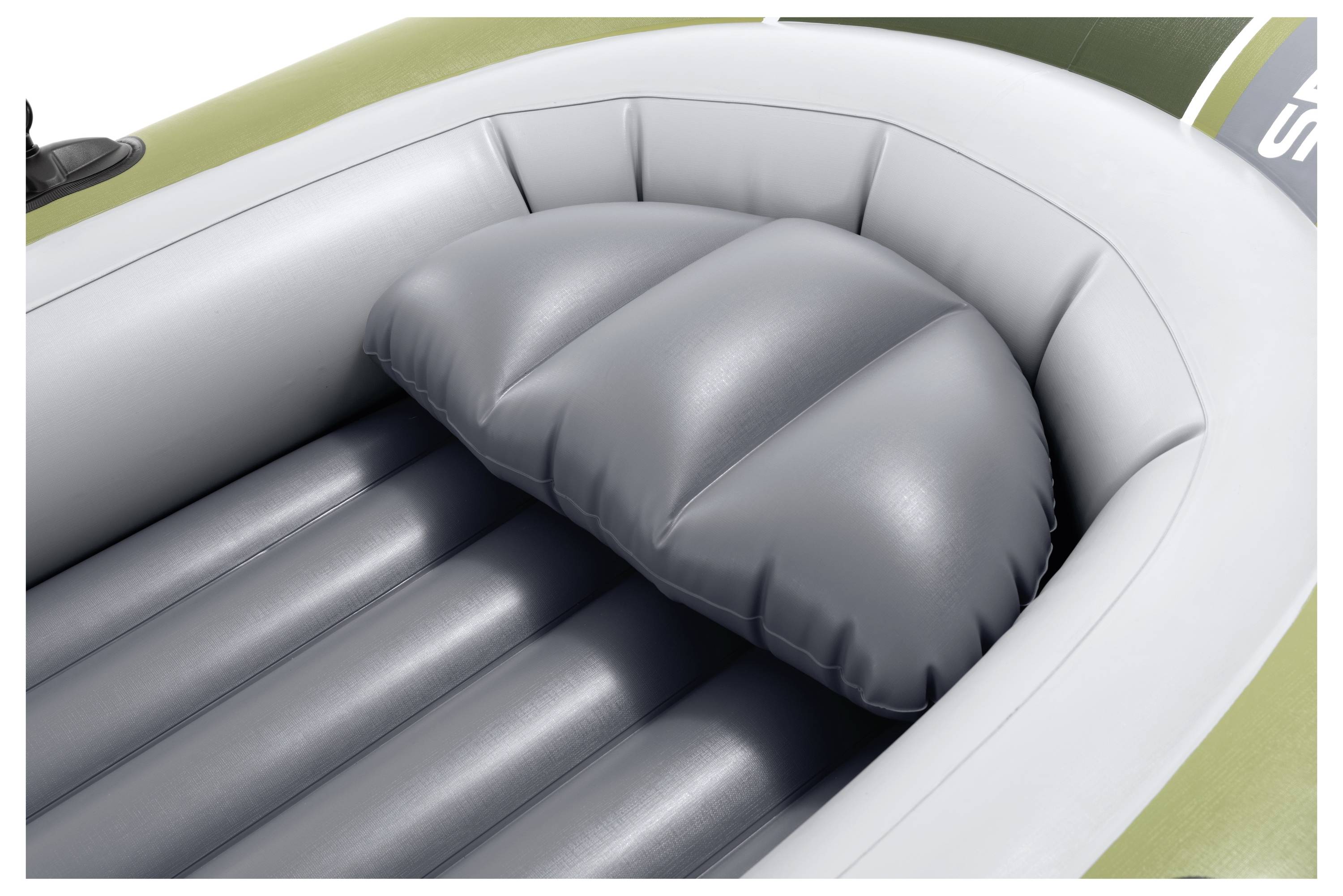 Inflatable gray seat cushion inside a boat, showing its ridged surface and snug fit, providing comfort and support for passengers.