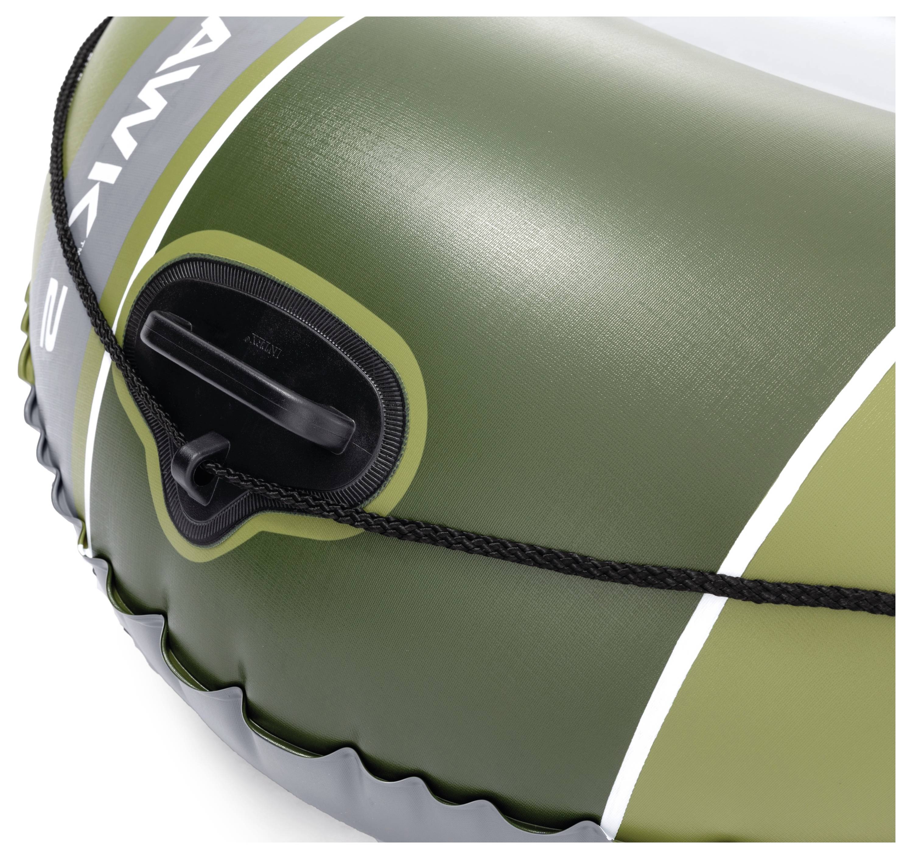 'A close-up of a green inflatable boat showing the texture and an attached grab line with a black handle, highlighting the boat's exterior features.'