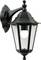 A black, wall-mounted outdoor lantern with a classic design, featuring a clear glass enclosure and decorative finial on top.