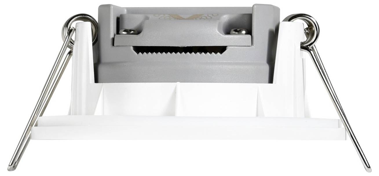 A close-up of a mechanical part with a gray body, white base, and metal springs on either side. The function is unclear from the image.